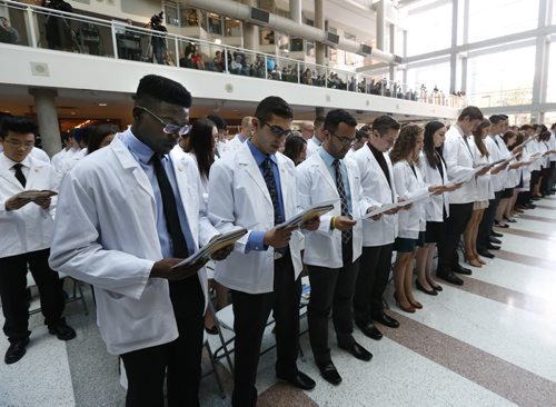 A 110 medical students in the class of 2019 said the Hippocratic Oath during the White Coat Ceremony at the University of Manitoba's College of Medicine Faculty of Health Sciences inaugural exercises on Wednesday. The white coat ceremony in front of family and friends welcomes medical students and establishes a psychological contract for the practice of medicine and the importance of compassionate care for the patient.  The event was held in the Brodie Centre.    Wayne Glowacki / Winnipeg Free Press August 19 2015