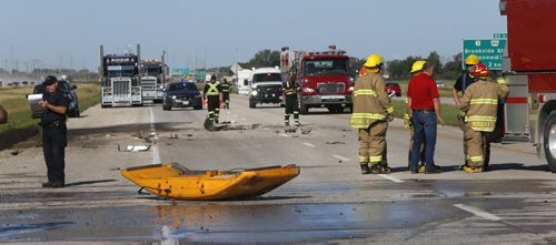 Debris on the Perimeter Hwy. on the east bound lanes between Brookside Blvd. and Pipeline Rd. after a truck carrying gravel overturned and caught fire. The condition of the driver is not known. Wayne Glowacki/Winnipeg Free Press August 19 2015