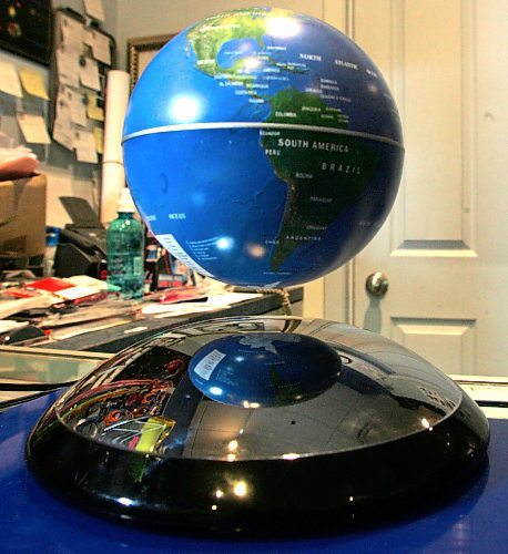 BORIS MINKEVICH / WINNIPEG FREE PRESS 071210 Gizmos Galaxy owner Kevin Mlodzinski poses with some floating globes in his St. Vital Mall store.