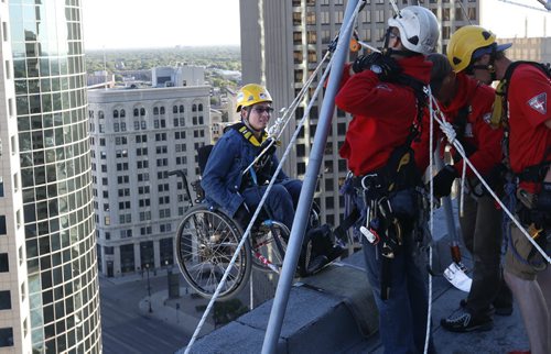 Peter Herget, a SMD Champion was one of the first to be lowered over the edge of the RBC Building at 220 Portage Ave. Thursday morning during the 11th Annual 2015 Easter Seals  Drop Zone  Winnipeg in support of children, youth and adults with disabilities in Manitoba. Over 90 people signed up to rappel 17 storeys in support of SMD Foundation/Easter Seals Manitoba. Participants generated a minimum of $1,500 in pledges to participate in this adventure. The goal this year is to raise $150,000, which will surpass $1 million raised in Manitoba since the Easter Seals Drop Zone began in 2005. Wayne Glowacki / Winnipeg Free Press August 20 2015