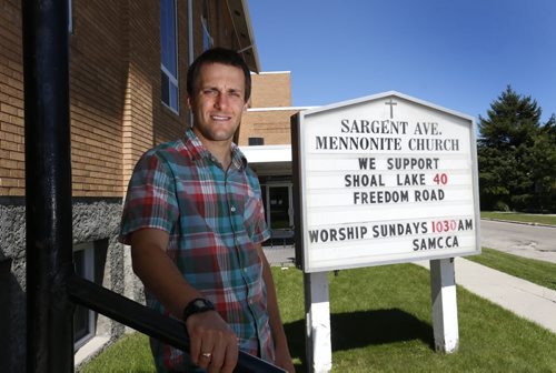 Mark Tiessen-Dyck with the sign by the Sargent Avenue Mennonite Church in Winnipeg.  Re: faith groups of all stripes working on Freedom Road campaign, and churches are putting their support on their signs.   Story by    Wayne Glowacki / Winnipeg Free Press August 20 2015