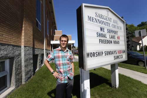 Mark Tiessen-Dyck with the sign by the Sargent Avenue Mennonite Church in Winnipeg.  Re: faith groups of all stripes working on Freedom Road campaign, and churches are putting their support on their signs.   Story by    Wayne Glowacki / Winnipeg Free Press August 20 2015