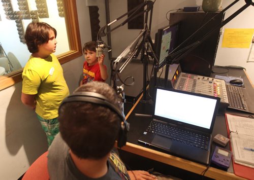 Sports Talk radio host Marc Cloutier from CKUW has two students from kids radio camp held at University Of Winnipeg- Brothers Alfie Kixen, left, and Ron held at University Of Winnipeg - See Jessicas story- Aug 20, 2015   (JOE BRYKSA / WINNIPEG FREE PRESS)