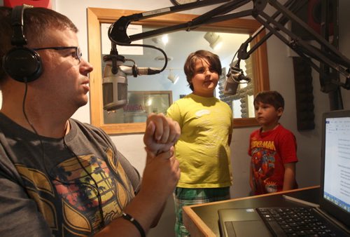 Sports Talk radio host Marc Cloutier from CKUW has two students from kids radio camp held at University Of Winnipeg- Brothers Alfie Kixen, centre, and Ron held at University Of Winnipeg - See Jessicas story- Aug 20, 2015   (JOE BRYKSA / WINNIPEG FREE PRESS)