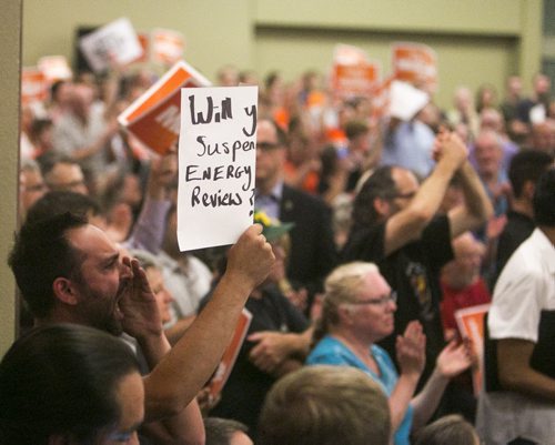 A crowd member continues to interrupt as Thomas Mulcair holds a rally at the RBC Convention Centre in Winnipeg on Thursday, Aug. 20, 2015.   Mikaela MacKenzie / Winnipeg Free Press