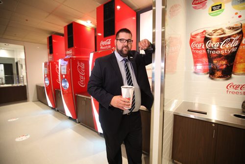 Kellen Jasper, GM of the Grant Park Theatre  shows off the new Freestyle drink machines now available at the renovated cinema.   One of several photos for this story illustrating its upgrades. See Randall King's story.  Aug 21, 2015 Ruth Bonneville / Winnipeg Free Press