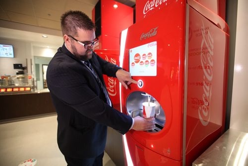 Kellen Jasper, GM of the Grant Park Theatre  shows off the new Freestyle drink machines now available at the renovated cinema.   One of several photos for this story illustrating its upgrades. See Randall King's story.  Aug 21, 2015 Ruth Bonneville / Winnipeg Free Press