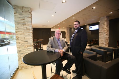 Neil Campbell, President and CEO of Landmark Cinemas (left) and Kellen Jasper, GM of the Grant Park Theatre  in a newly created lounge area in front of the theatre. One of several photos for this story illustrating its upgrades. See Randall King's story.  Aug 21, 2015 Ruth Bonneville / Winnipeg Free Press
