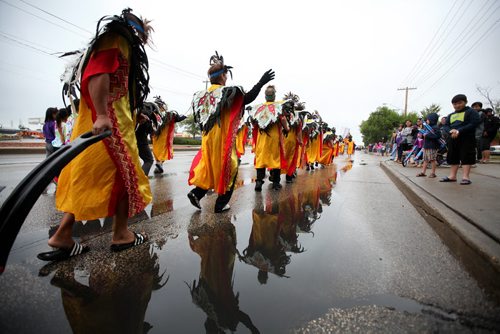 The rain did not stop the Filipino community from taking part in their 3rd annual street festival which kicked off at North Gate Mall Saturday morning with a long parade of dancers and entertainers that made their way down McPhillips Street to Garden City Mall where the festivities will continue throughout the day.  Standup photo Aug 22, 2015 Ruth Bonneville / Winnipeg Free Press