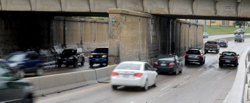 A pair of stalled cars sit under the Jubilee Underpass after heavy rains hit the city, Saturday, August 22, 2015. (TREVOR HAGAN/WINNIPEG FREE PRESS)