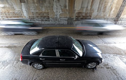 One of two stalled cars sit under the Jubilee Underpass after heavy rains hit the city, Saturday, August 22, 2015. (TREVOR HAGAN/WINNIPEG FREE PRESS)