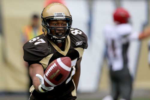 University of Manitoba Bisons' Stephen Ugbah celebrates after scoring a touchdown against the Guelph Gryphons, Saturday, August 22, 2015. (TREVOR HAGAN/WINNIPEG FREE PRESS)