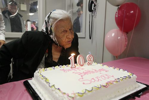 August 24, 2015 - 150824  -  Sarah Harper, who turns 109 today Monday, August 24, 2015, blows out candles at a celebration of her birthday. John Woods / Winnipeg Free Press