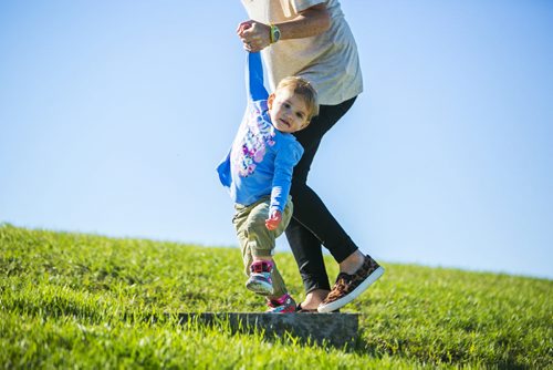 Mila Hornberger makes it up the stairs with a helping hand from her mom, Ivy, at Garbage Hill in Winnipeg on Tuesday, Aug. 25, 2015.   Mikaela MacKenzie / Winnipeg Free Press