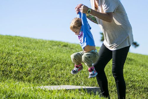 Mila Hornberger makes it up the stairs with a helping hand from her mom, Ivy, at Garbage Hill in Winnipeg on Tuesday, Aug. 25, 2015.   Mikaela MacKenzie / Winnipeg Free Press