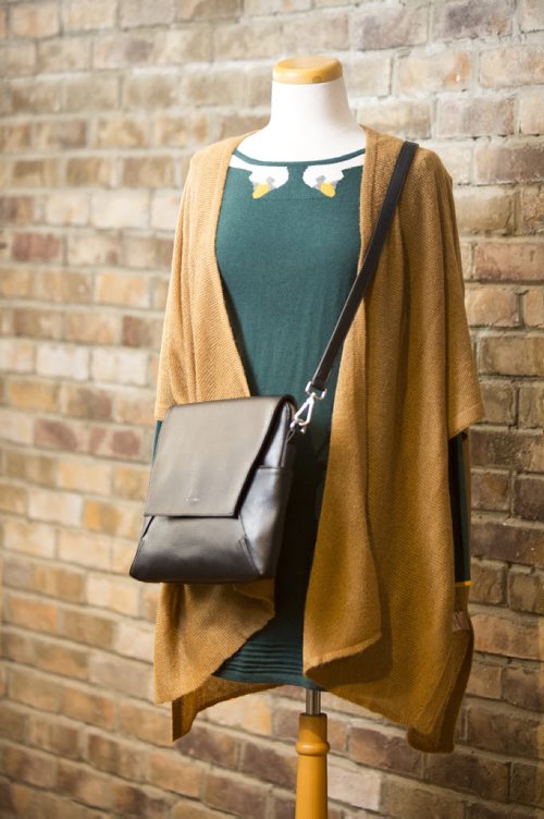 Cardigans and fall outfits are displayed at Out of the Blue in Osborne in Winnipeg on Tuesday, Aug. 25, 2015.   Mikaela MacKenzie / Winnipeg Free Press