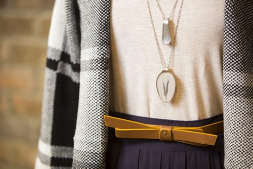 Cardigans and fall outfits are displayed at Out of the Blue in Osborne in Winnipeg on Tuesday, Aug. 25, 2015.   Mikaela MacKenzie / Winnipeg Free Press