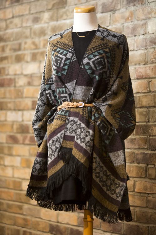 Cardigans and fall outfits are displayed at Out of the Blue in Osborne in Winnipeg on Tuesday, Aug. 25, 2015.   Mikaela MacKenzie / Winnipeg Free Press