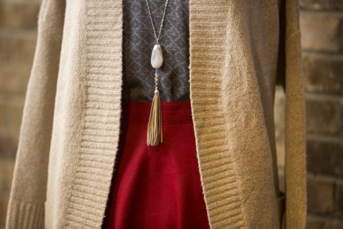 Cardigans and fall outfits are displayed at Out of the Blue in Osborne in Winnipeg on Tuesday, Aug. 25, 2015.   Mikaela MacKenzie / Winnipeg Free Press