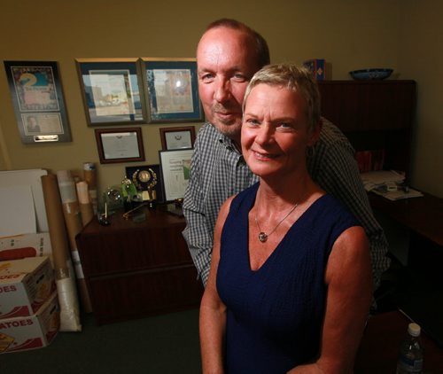 Larry McIntosh and his wife Shelley pose in their offices at Peak of the Market. They have donated to the cost of a Faron Hall statue and will be receiving a Red Cross Award for Humanitarian of the year.....See Gord Sinclair's story.  August 26, 2015 - (Phil Hossack / Winnipeg Free Press)
