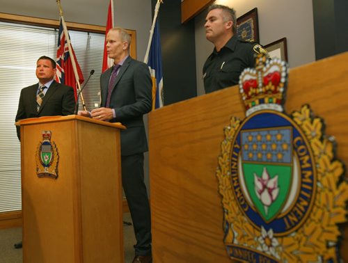 L to R- Acting Inspector Gene Bowers Winnipeg Police Service Counter Exploitation Unit ( CEU) with Cam MacKid of CEU and Constable Jason Michalyshen speak of charges from Project Create- a initiative to combat the sex trade in Winnipeg- see story- Aug 27, 2015   (JOE BRYKSA / WINNIPEG FREE PRESS)