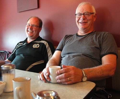 MacGregor, MB. - Herb Seaver, right, talks to Bart on election boundary changes. Left is Dan Zacharias. Shot at cafe in MacGregor. BORIS MINKEVICH / WINNIPEG FREE PRESS PHOTO August 27, 2015