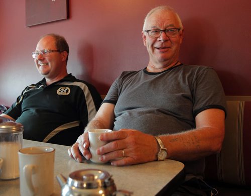 MacGregor, MB. - Herb Seaver, right, talks to Bart on election boundary changes. Left is Dan Zacharias. Shot at cafe in MacGregor. BORIS MINKEVICH / WINNIPEG FREE PRESS PHOTO August 27, 2015