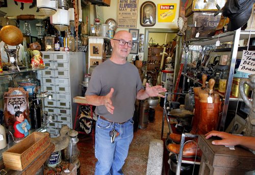 Carberry, MB. - Antique shop owner Joe Harding chats to Bart on election boundary changes. BORIS MINKEVICH / WINNIPEG FREE PRESS PHOTO August 27, 2015