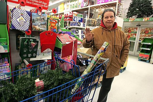 BORIS MINKEVICH / WINNIPEG FREE PRESS 071214 Wal Mart 24 hour shopping. Kim Bailes does some late night christmas shopping.