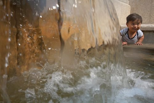 One and a half-year-old Kenzy Ramilo plays in the fountain behind the Manitoba Legislative Building Friday afternoon while out on a walk with his Grandmother. Standup photo   Aug 27, 2015 Ruth Bonneville / Winnipeg Free Press