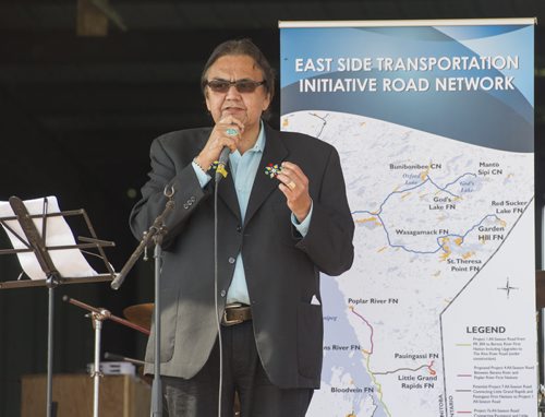 DAVID LIPNOWSKI / WINNIPEG FREE PRESS 150828 August 28, 2015  Aboriginal and Northern Affairs Minister Eric Robinson speaks during an event that included an announcement for the future site of a bridge over Pigeon River at Berens River Friday August 28, 2015 in Berens River. The bridge is part of the next stage of construction of the east-side road by The Manitoba East Side Road Authority. This stage would link Berens River to Bloodvein to the south.