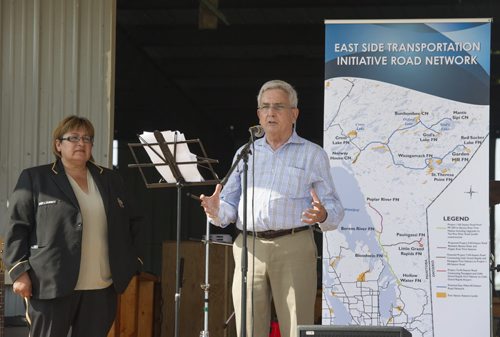 DAVID LIPNOWSKI / WINNIPEG FREE PRESS 150828 August 28, 2015  CEO of The Manitoba East Side Road Authority, Ernie Gilroy speaks alongside Chief Jackie Everett during an event that included an announcement for the future site of a bridge over Pigeon River at Berens River Friday August 28, 2015 in Berens River. The bridge is part of the next stage of construction of the east-side road by The Manitoba East Side Road Authority. This stage would link Berens River to Bloodvein to the south.