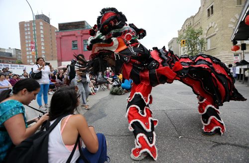 Ching Wu Athletic Association performs a Lion Dance to kick off the Chinatown Street Festival, Saturday, August 29, 2015. (TREVOR HAGAN/WINNIPEG FREE PRESS)