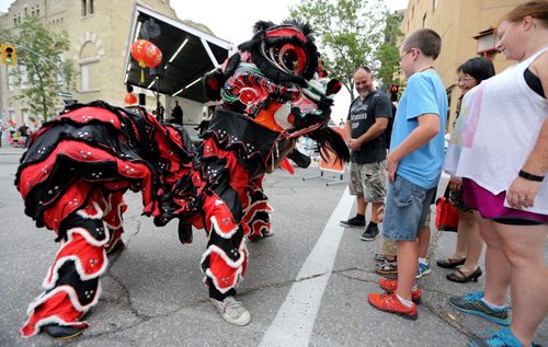 Ching Wu Athletic Association performs a Lion Dance to kick off the Chinatown Street Festival, Saturday, August 29, 2015. (TREVOR HAGAN/WINNIPEG FREE PRESS)