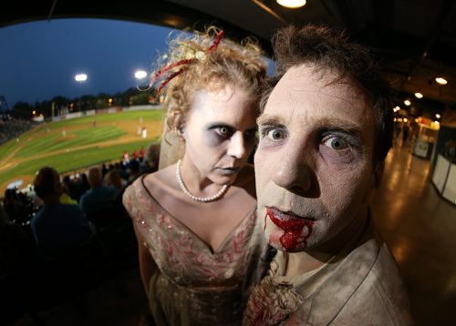 Tara Lambert and Chris Without the Hat, who together make up the Undead Newlyweds, at Zombie Night at Shaw Park during the Winnipeg Goldeyes vs the Fargo-Moorhead RedHawks, Saturday, August 29, 2015. (TREVOR HAGAN/WINNIPEG FREE PRESS)