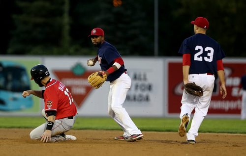 Winnipeg Goldeyes James Boddicker, right, flipped the ball to Casio Grider to get Fargo-Moorhead RedHawks Luke Bailey out, but could not turn the double play, Saturday, August 29, 2015. (TREVOR HAGAN/WINNIPEG FREE PRESS)