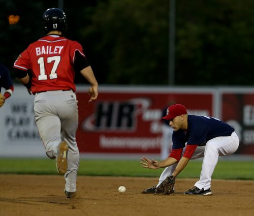 Winnipeg Goldeyes James Boddicker stops the ball to and is able to flip the ball to Casio Grider to get Fargo-Moorhead RedHawks Luke Bailey out, but could not turn the double play, Saturday, August 29, 2015. (TREVOR HAGAN/WINNIPEG FREE PRESS)