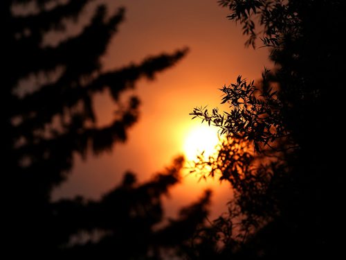 Smoke blocks the sun as it begins to set near Investors Group Field, Saturday, August 29, 2015. (TREVOR HAGAN/WINNIPEG FREE PRESS)