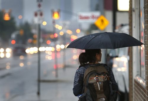 Rain and thunder storms roll through Winnipeg on a warm Monday morning. This is a view down Notre Dame Ave. Wayne Glowacki / Winnipeg Free Press August 31 2015