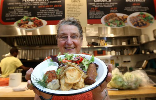 Tabitha Langel  of Babas Tall Grass Pantry shows perogy plate -  See Marion Warhaft Forks restaurant kiosk story - Aug 31, 2015   (JOE BRYKSA / WINNIPEG FREE PRESS)
