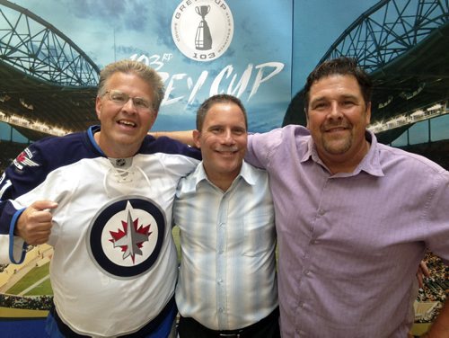 Dancing Gabe Langlois left, his biographer Daniel Perron, centre,  and the local legend's brother, Mike Langlois make a book-tour stop in the Free Press atrium Wednesday. Gordon Sinclair Jr. Photo / Winnipeg Free Press September 2, 2015
