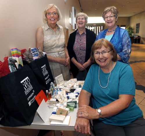 Volunteer Column. In foreground is Cécile Alarie-Skene and from left, Diane Bewell, Ruth Hartnell and Brenda Zebrynski, they are members/volunteers of the Retired Women Teachers' Association. They are beside a sample of toiletries the Association collects and donates to women's shelters in Winnipeg.    Aaron Epp story. Wayne Glowacki / Winnipeg Free Press Sept.3  2015