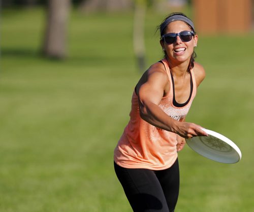 Jess Cobb weathers the heat with some frisbee in Kildonan Park. She was there with her good friend Terry Burgoyne. BORIS MINKEVICH / WINNIPEG FREE PRESS PHOTO Sept. 3, 2015