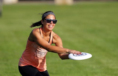 Jess Cobb weathers the heat with some frisbee in Kildonan Park. She was there with her good friend Terry Burgoyne. BORIS MINKEVICH / WINNIPEG FREE PRESS PHOTO Sept. 3, 2015