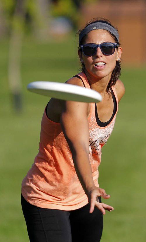 Jess Cobb weathers the heat with some frisbee in Kildonan Park. She was there with her good friend Terry Burgoyne. BORIS MINKEVICH / WINNIPEG FREE PRESS PHOTO Sept. 3, 2015