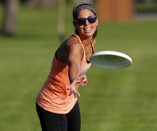 Jess Cobb weathers the heat with some frisbee in Kildonan Park. She was there with her good friend Terry Burgoyne. BORIS MINKEVICH / WINNIPEG FREE PRESS PHOTO Sept. 3, 2015