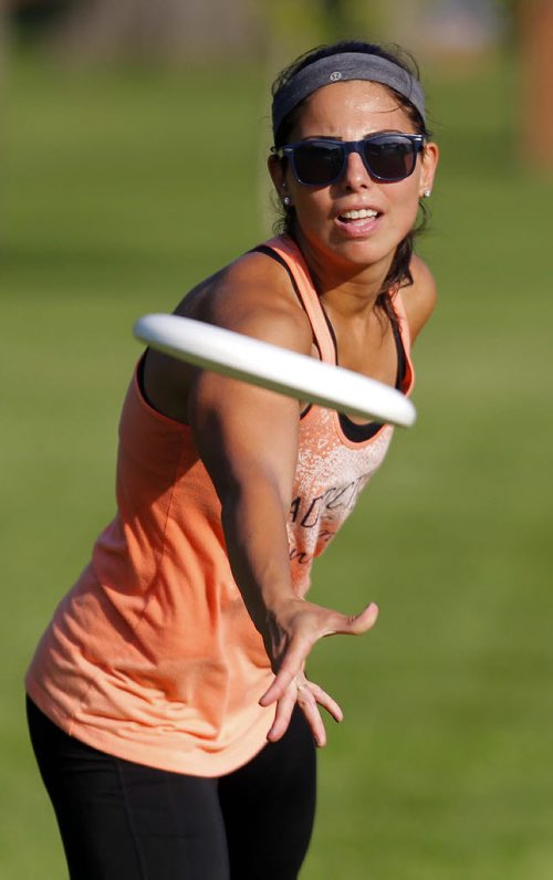 Jess Cobb weathers the heat with some frisbee in Kildonan Park. She was there with her good friend Terry Burgoyne. BORIS MINKEVICH / WINNIPEG FREE PRESS PHOTO Sept. 3, 2015