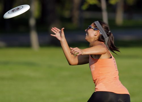 Jess Cobb weathers the heat with some frisbee in Kildonan Park. She was there with her good friend Terry Burgoyne. BORIS MINKEVICH / WINNIPEG FREE PRESS PHOTO Sept. 3, 2015