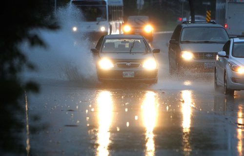 Wet roads in St. Vital on St. Marys Road near Regal. BORIS MINKEVICH / WINNIPEG FREE PRESS PHOTO Sept. 4, 2015