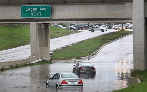 Cars starnded in deep water from todays storm in the underpass southbound on Route 90 near Logan-North bound lanes are flooded but police are letting semi trailer through because of high clearance- Breaking News- Aug 28, 2015   (JOE BRYKSA / WINNIPEG FREE PRESS)